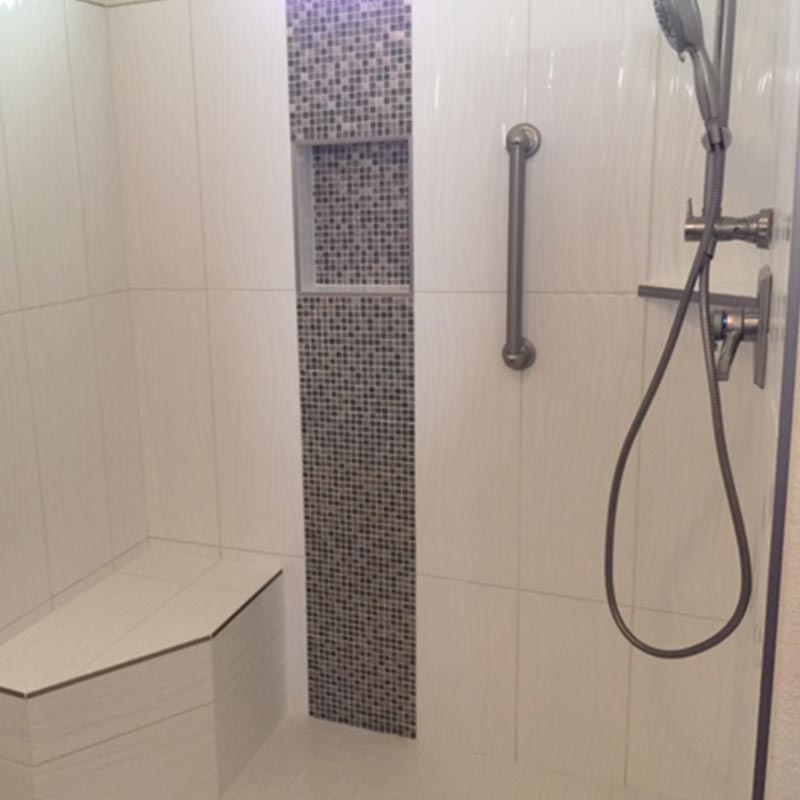 walk-in shower with bench after remodel