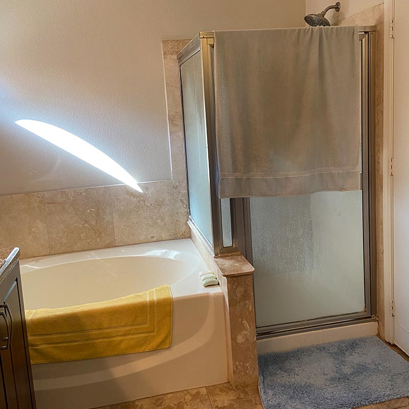 before photo of bathroom remodel with walk in shower